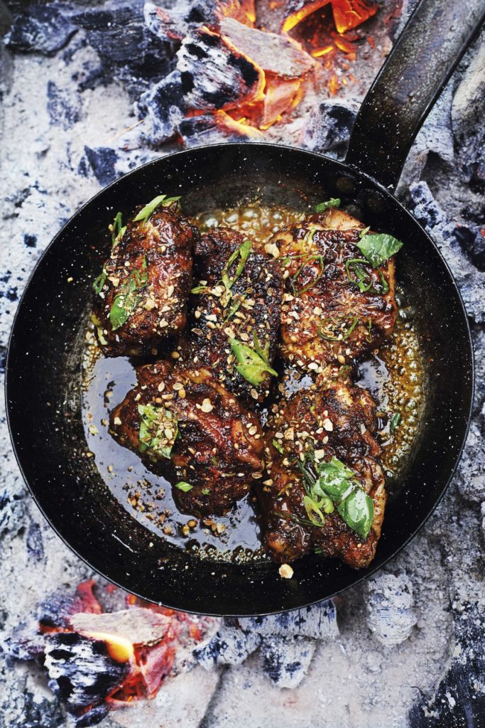 Smoked Chicken Thighs with Saffron and Orange Blossom Caramel, Hazelnut Dukkah and Basil