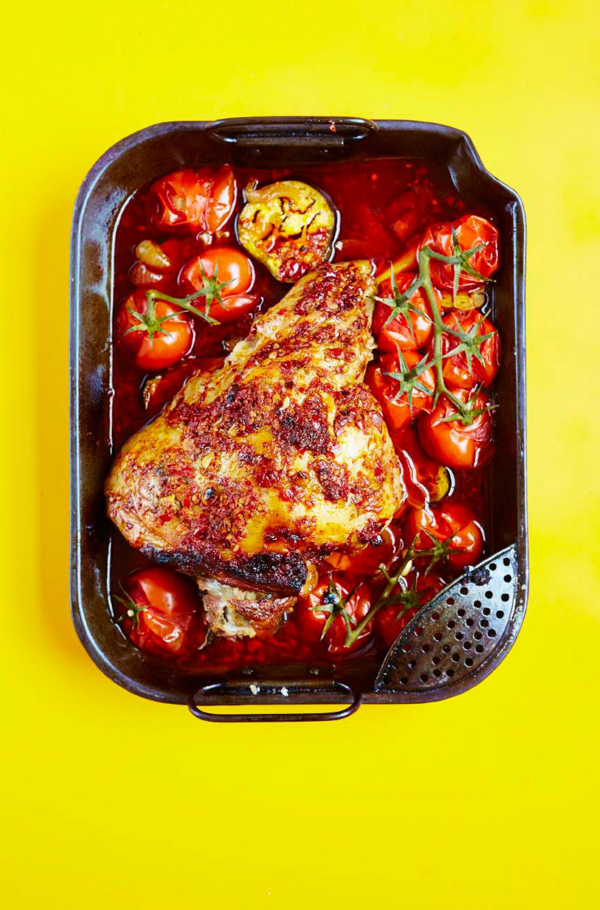 Slow-cooked Leg of Lamb with Harissa, Roasted Aubergines & Tomatoes