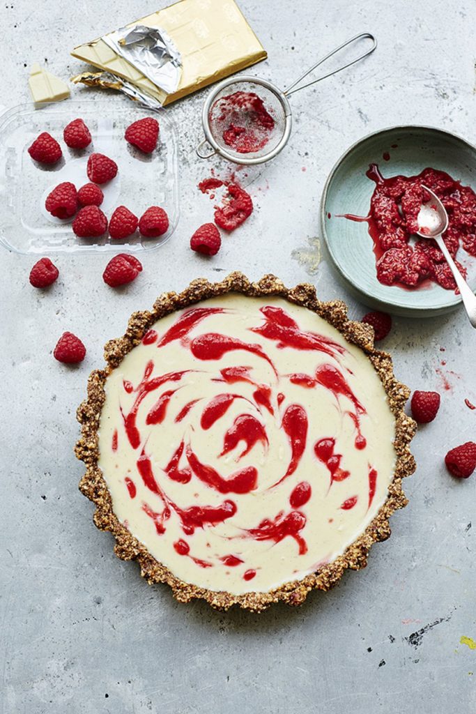White Chocolate, Cardamom and Raspberry Tart with a Pecan and Hazelnut Base