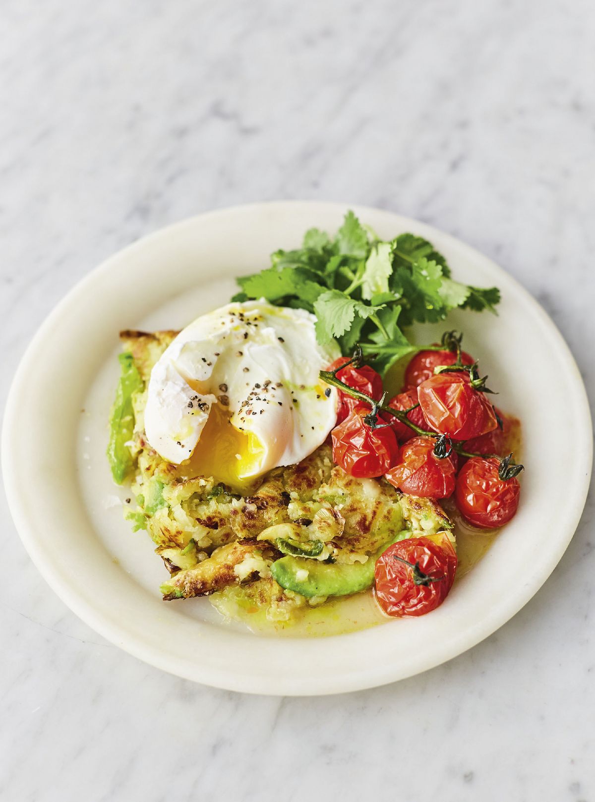 Jamie Oliver’s Avocado and Jalapeño Hash Brown with Roasted Vine Tomatoes, Spring Onions, Coriander, and Poached Eggs
