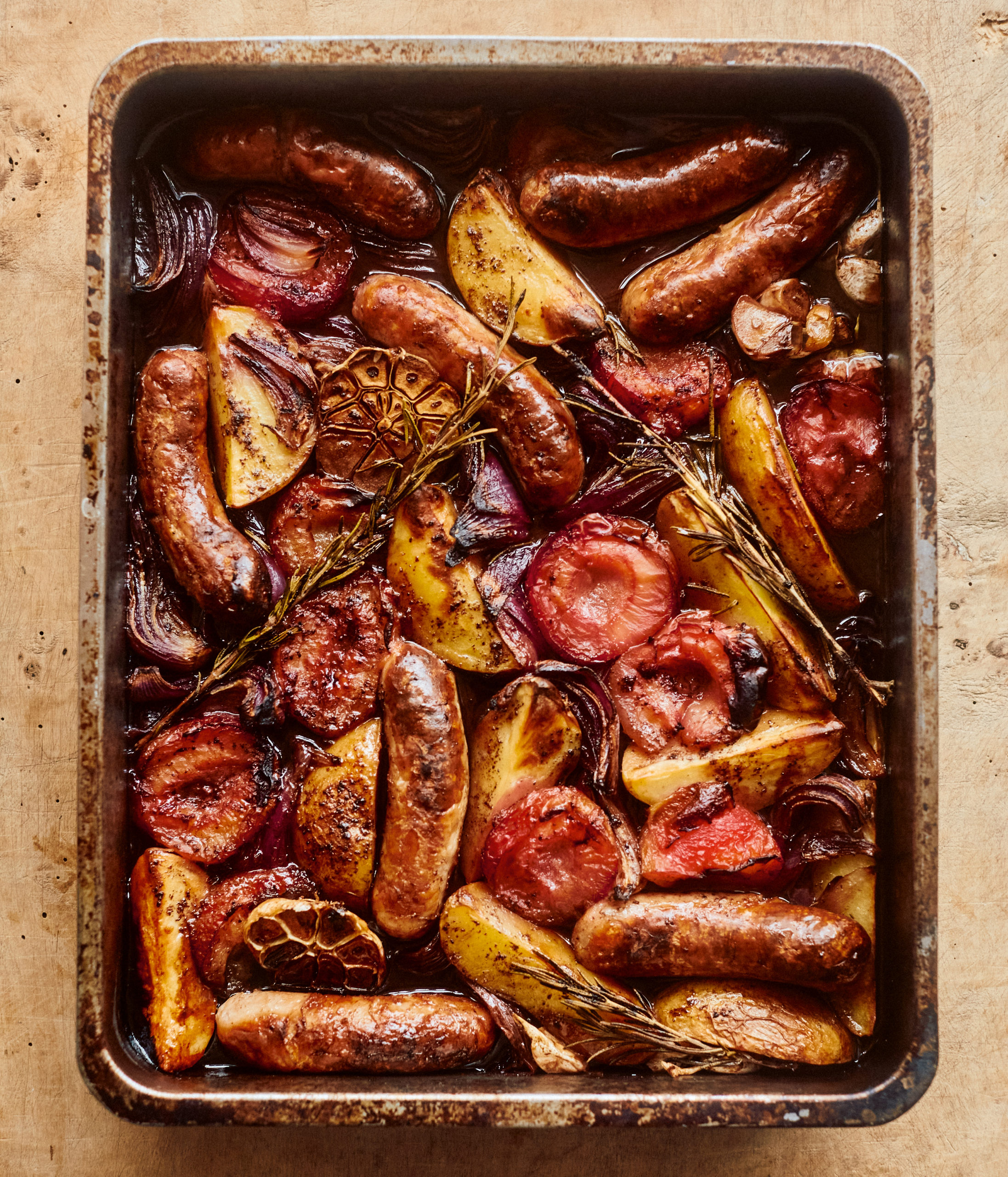ottolenghi sausage and plum tray bake