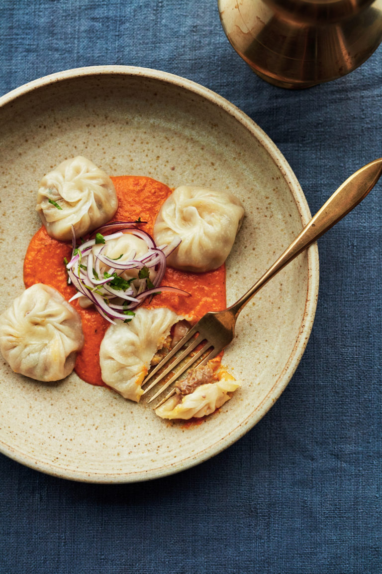 Kukhura ko momo - Steamed chicken momos with ginger & chilli with a tomato sesame chutney