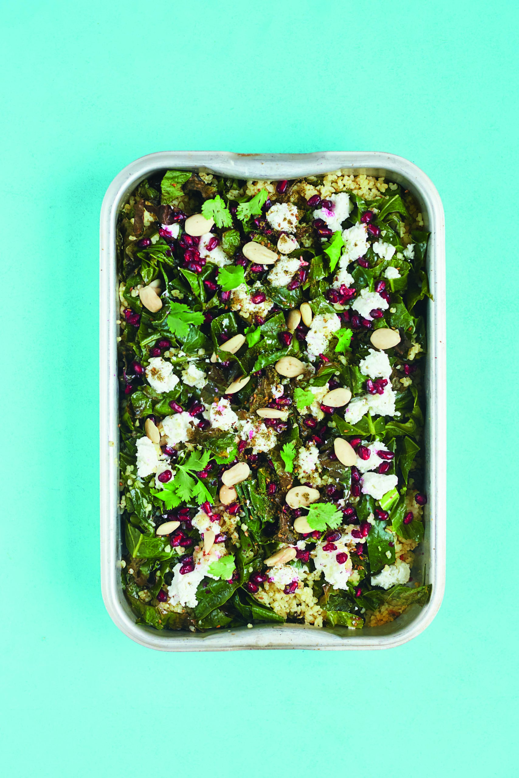 Crispy Kale and Bulgur Wheat Salad With Pomegranates, Preserved Lemon, Goat’s Cheese and Almonds
